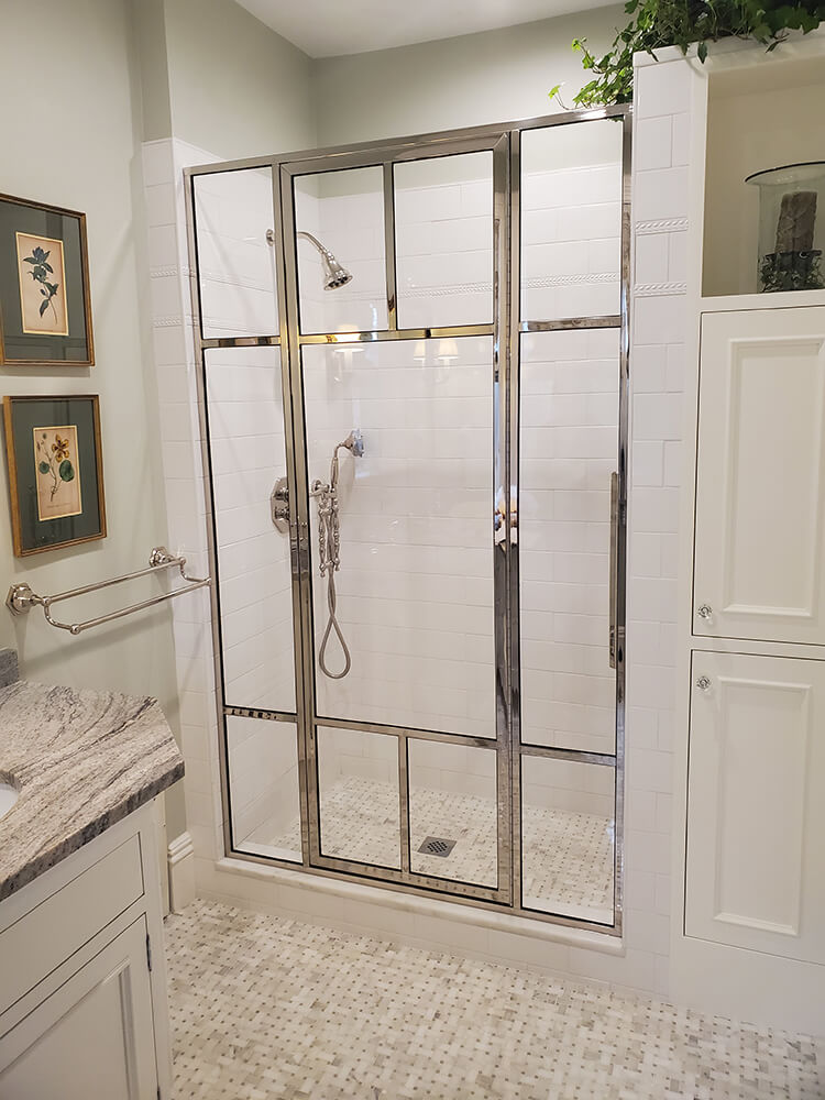 clear glass shower with silver window paneling