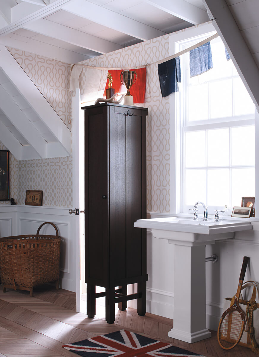 white pedestal sink with dark wood tall cabinet
