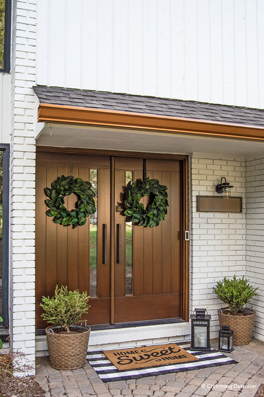 dark wood entry doors with wreaths