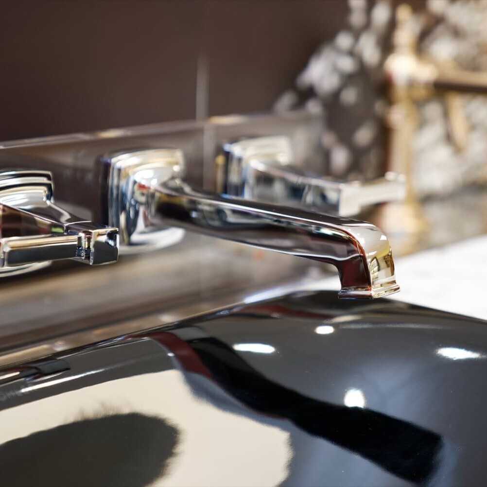 chrome sink on a black countertop