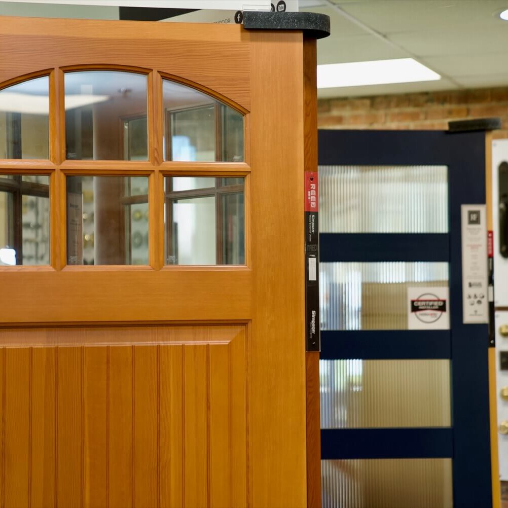 medium stain wood door with paneled glass